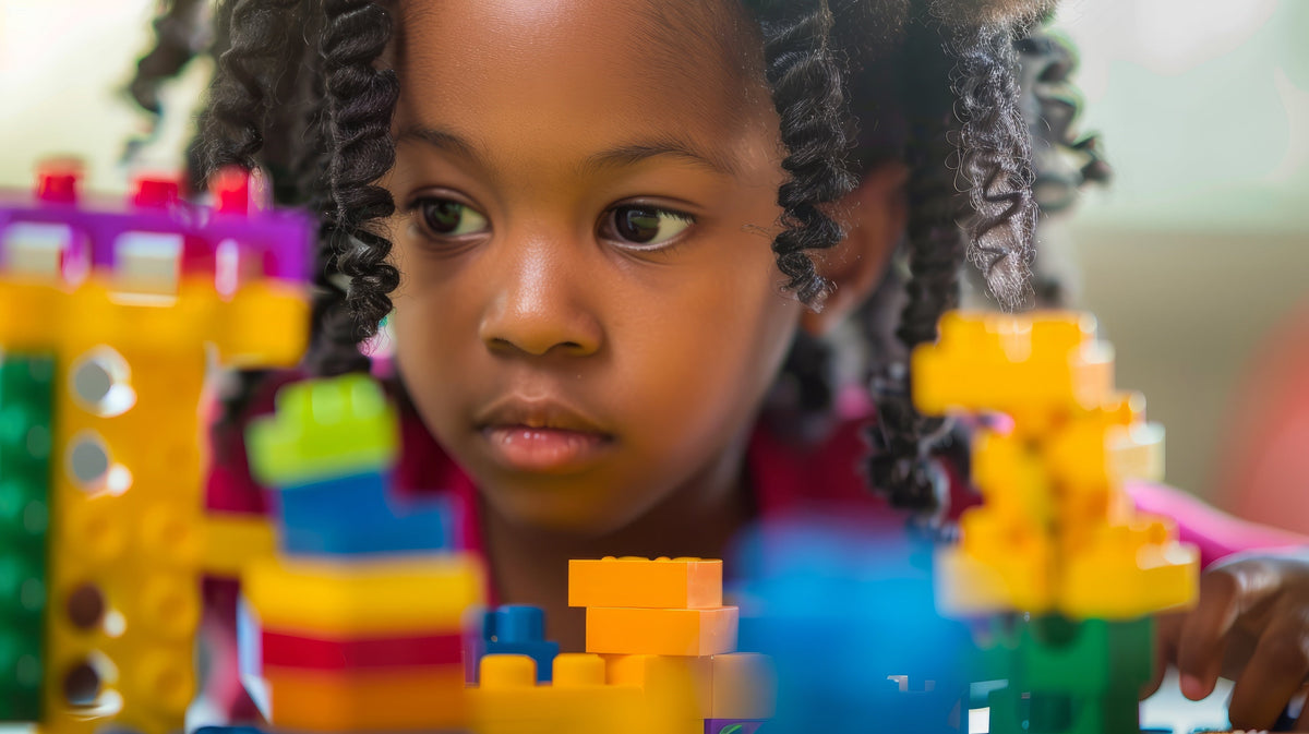 A child playing and building with Pix Brix colorful pixel bricks
